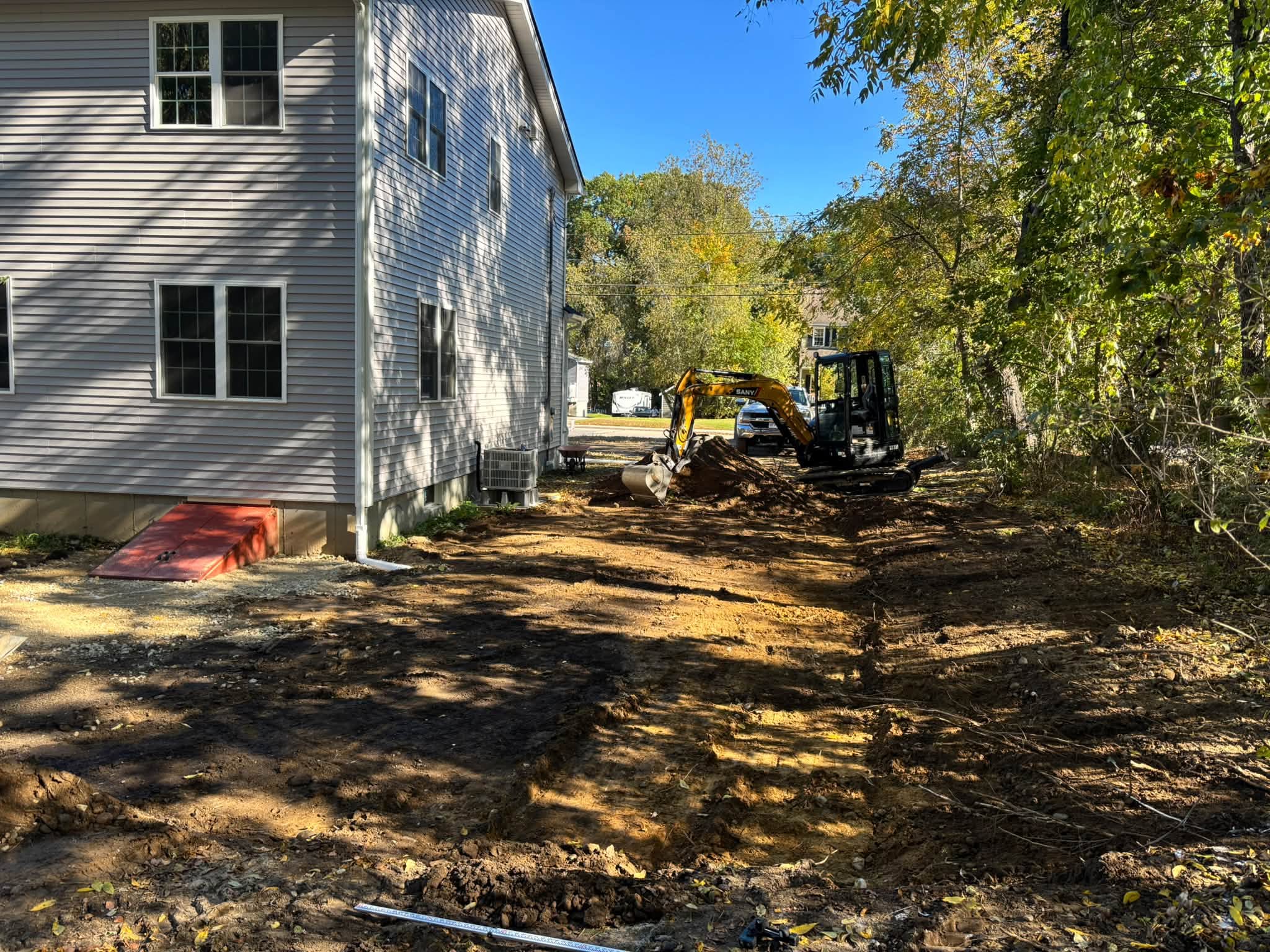 Existing grade sloping toward bulkhead — Auburn, MA